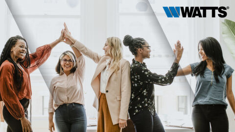 A group of women high fiving 